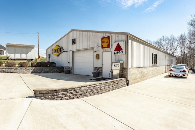 exterior space featuring concrete driveway