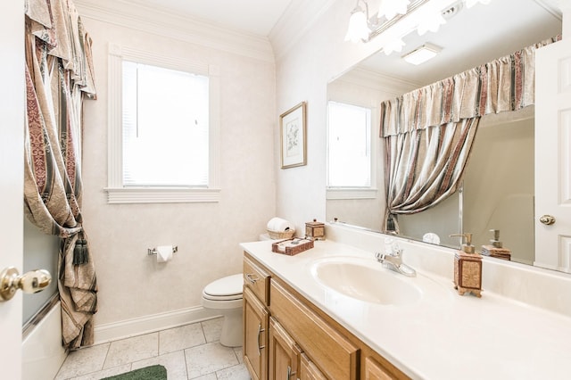 bathroom with plenty of natural light, baseboards, crown molding, and vanity