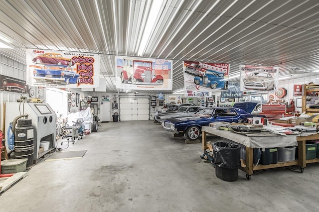 garage with metal wall and a workshop area