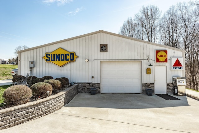 detached garage featuring driveway