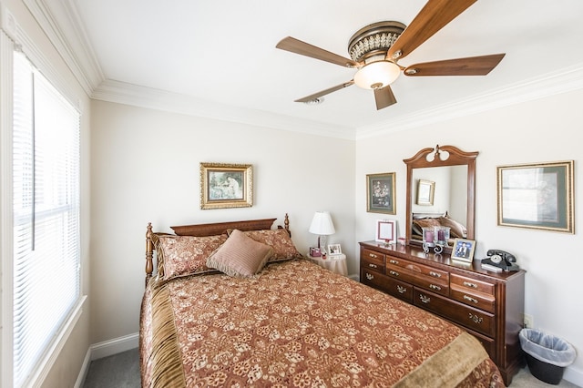 carpeted bedroom with a ceiling fan, multiple windows, crown molding, and baseboards