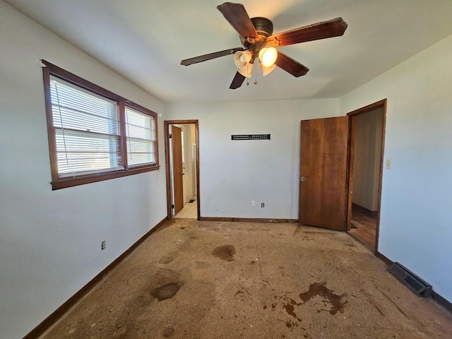 unfurnished bedroom with a ceiling fan, visible vents, and baseboards