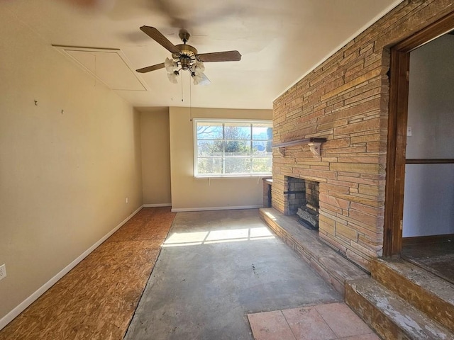 unfurnished living room with a fireplace, baseboards, and a ceiling fan