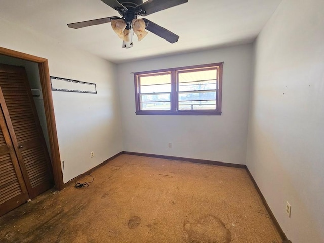 unfurnished bedroom with a ceiling fan, a closet, and baseboards