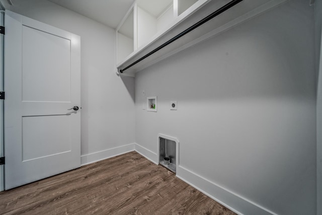 clothes washing area with laundry area, baseboards, dark wood finished floors, washer hookup, and electric dryer hookup