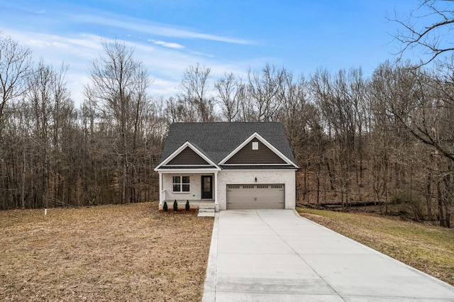 view of front facade with driveway and brick siding