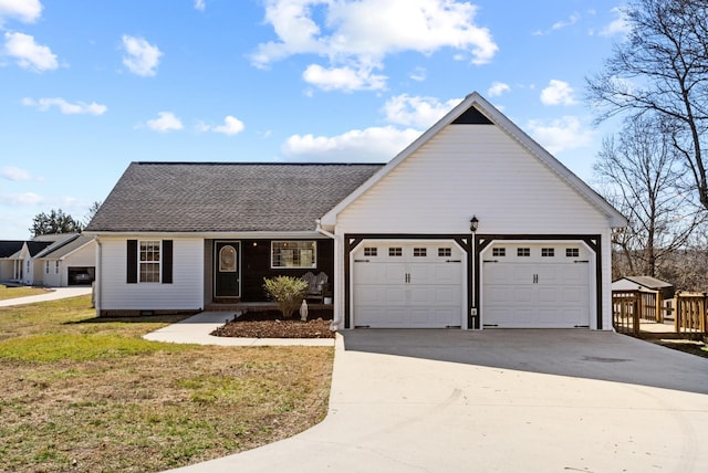 ranch-style house featuring a garage, a shingled roof, concrete driveway, crawl space, and a front yard