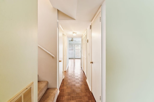 corridor featuring stairway and visible vents