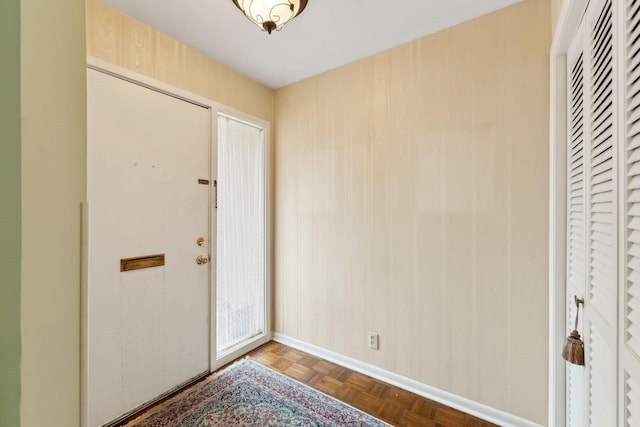 foyer entrance with baseboards