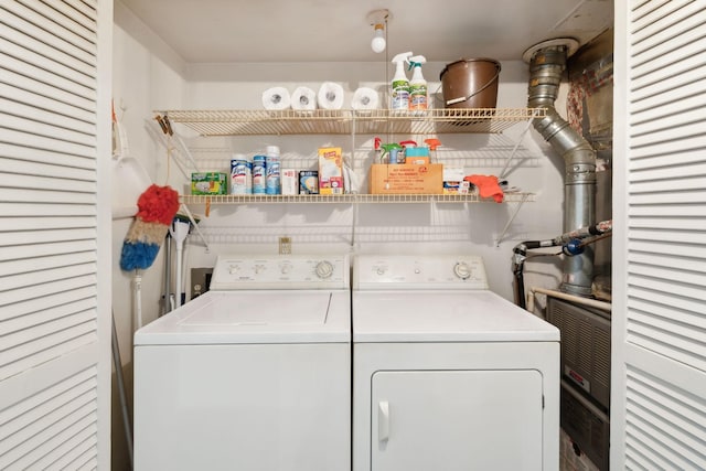 clothes washing area featuring laundry area and washer and dryer