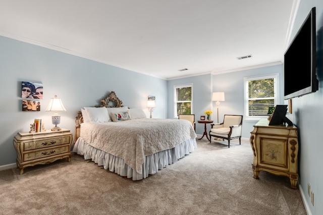 carpeted bedroom featuring ornamental molding, visible vents, and baseboards