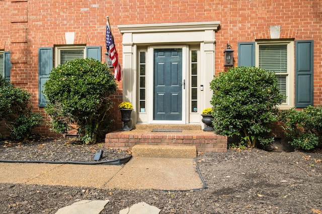 entrance to property with brick siding