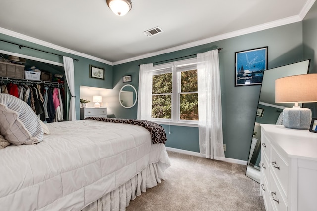 bedroom featuring light colored carpet, visible vents, baseboards, ornamental molding, and a closet