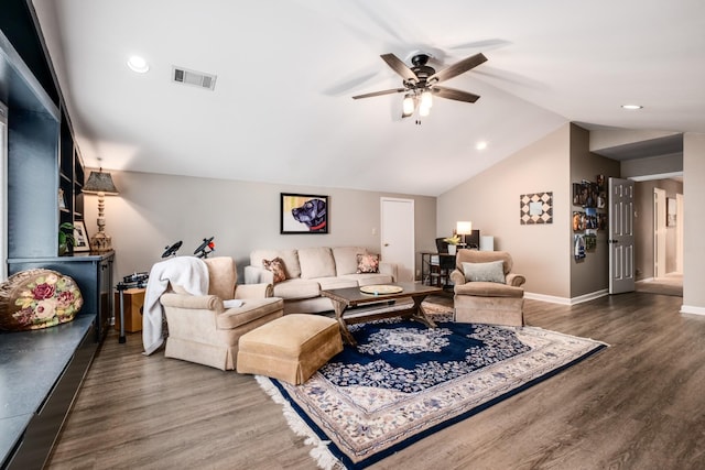 living room featuring lofted ceiling, wood finished floors, a ceiling fan, visible vents, and baseboards