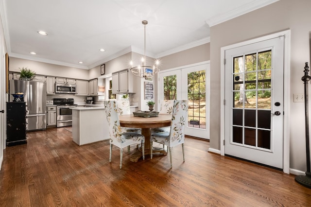 dining room featuring baseboards, ornamental molding, dark wood-type flooring, and recessed lighting