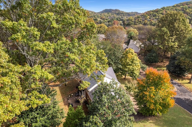 drone / aerial view featuring a forest view