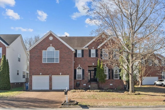 view of front facade featuring a garage, brick siding, and driveway