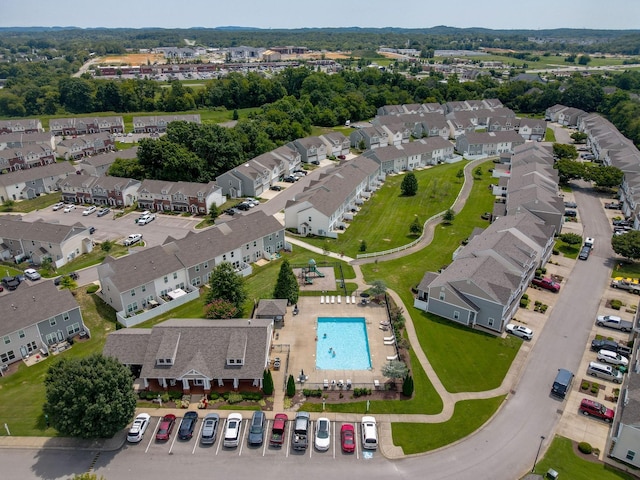 birds eye view of property with a residential view