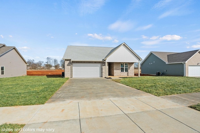 view of front facade with a front yard, brick siding, driveway, and an attached garage