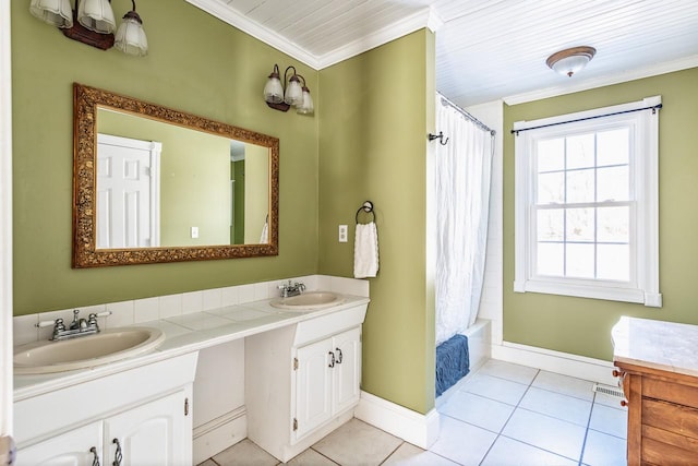 bathroom featuring tile patterned flooring, a sink, and crown molding