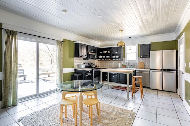 kitchen with light tile patterned floors, appliances with stainless steel finishes, open shelves, and a sink