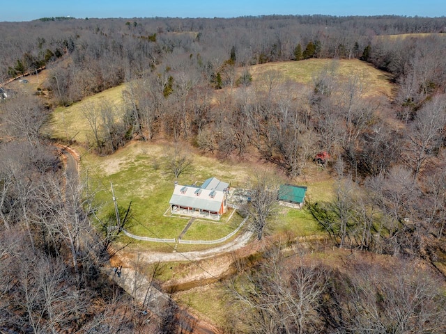 drone / aerial view with a view of trees