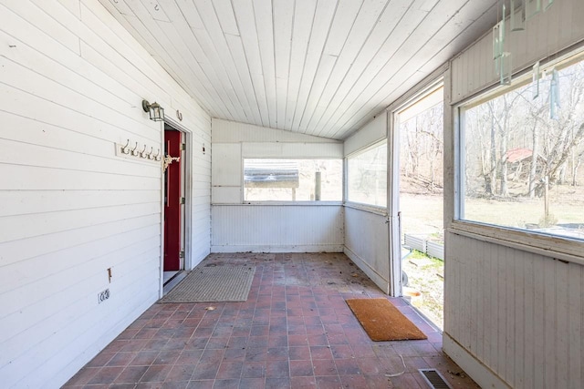 unfurnished sunroom featuring wood ceiling, visible vents, and vaulted ceiling