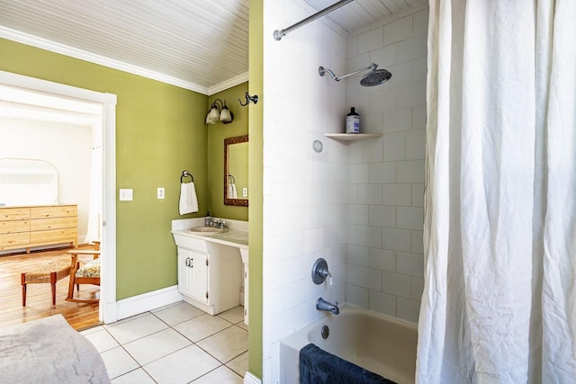 full bath featuring crown molding, shower / bath combo, vanity, baseboards, and tile patterned floors