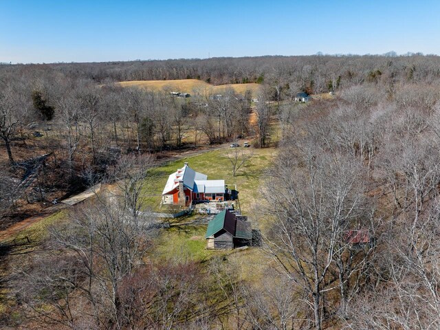 bird's eye view featuring a rural view and a wooded view