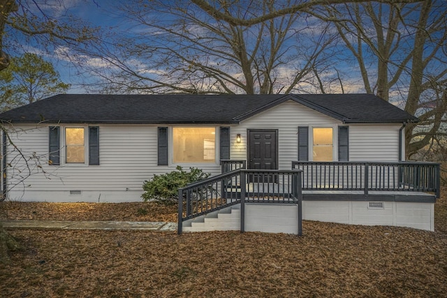 ranch-style home featuring a shingled roof and crawl space