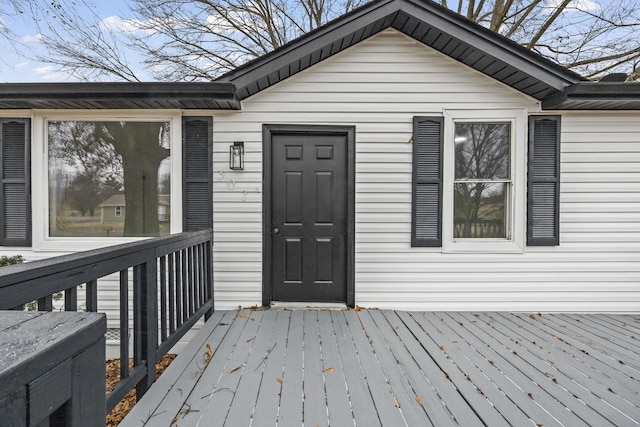 view of exterior entry featuring a deck