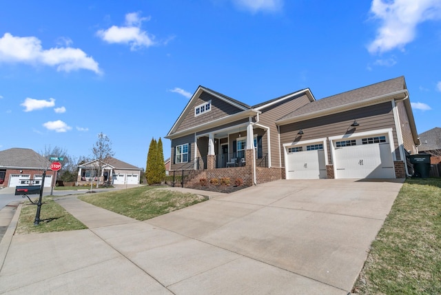 view of front of home with brick siding, covered porch, a front yard, a garage, and driveway