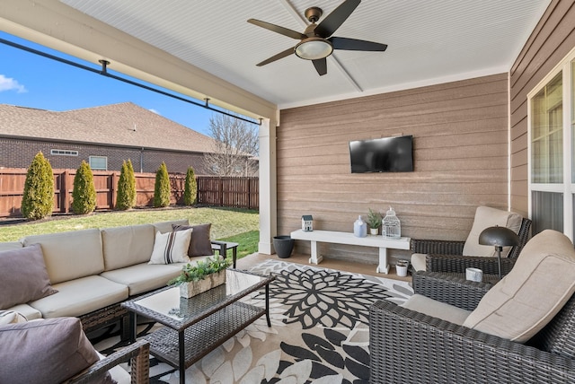 view of patio / terrace featuring a fenced backyard, an outdoor hangout area, and ceiling fan