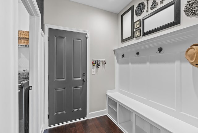 mudroom featuring dark wood finished floors and baseboards