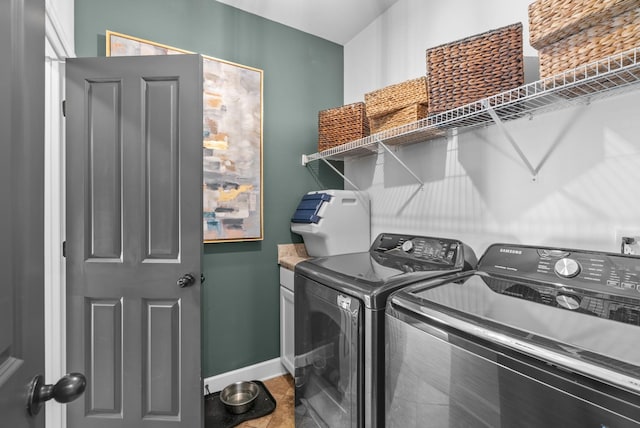 laundry area with laundry area, tile patterned flooring, baseboards, and separate washer and dryer