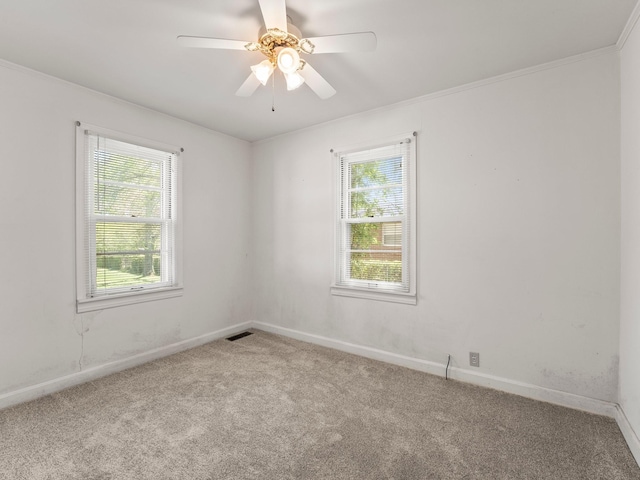 unfurnished room with carpet floors, ceiling fan, visible vents, and baseboards