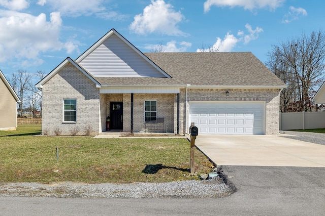 view of front facade with brick siding, a shingled roof, an attached garage, a front yard, and driveway