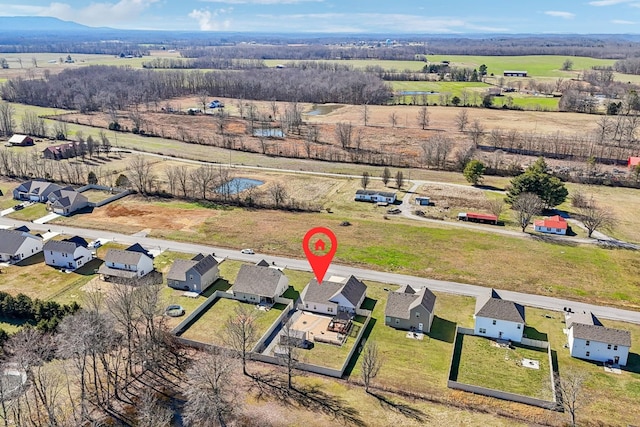 birds eye view of property featuring a rural view