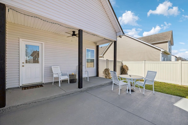 view of patio / terrace featuring ceiling fan, outdoor dining area, and fence