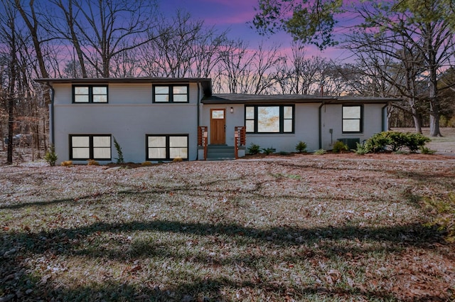 tri-level home with brick siding