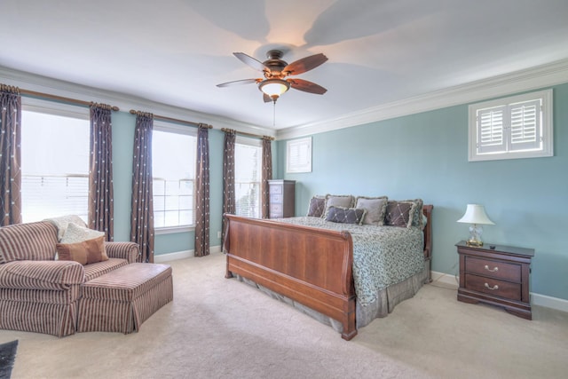 bedroom with ornamental molding, carpet, a ceiling fan, and baseboards