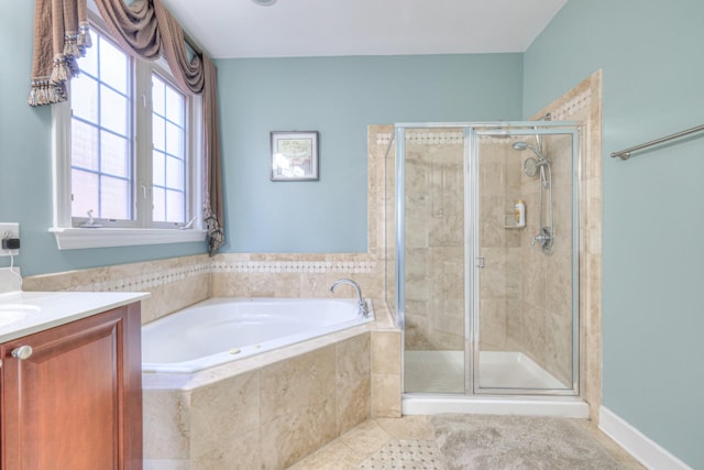 bathroom with tile patterned flooring, a shower stall, vanity, and a bath