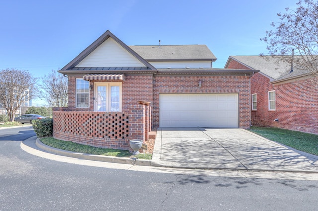 view of front facade featuring a garage, concrete driveway, and brick siding