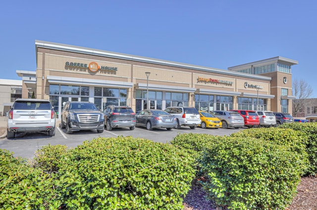 view of property featuring uncovered parking