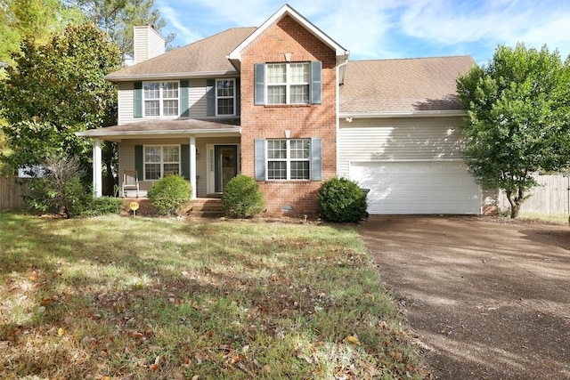 view of front of home featuring driveway, a garage, a chimney, fence, and brick siding