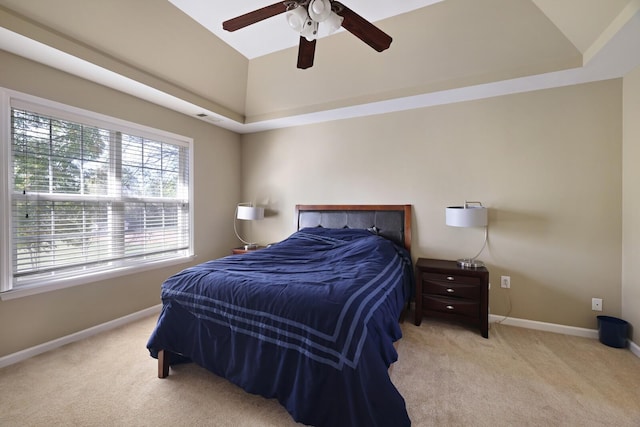 bedroom featuring visible vents, baseboards, a raised ceiling, ceiling fan, and carpet floors