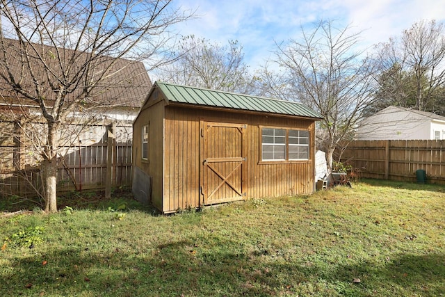 view of shed featuring a fenced backyard