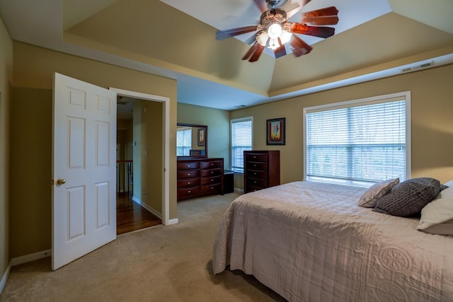 1128 Carriage Park Dr, Franklin, TN 37064 - bedroom featuring baseboards, light carpet, a ceiling fan, visible vents, and a raised ceiling