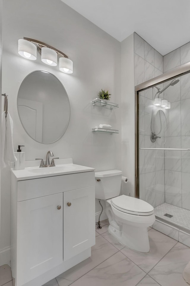 full bathroom with marble finish floor, a stall shower, vanity, and toilet