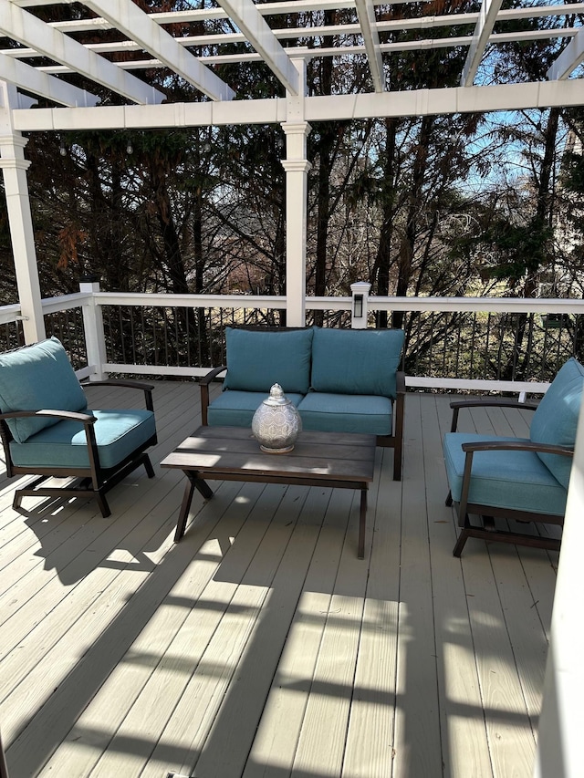 deck with an outdoor hangout area and a pergola